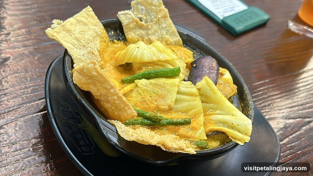 Curry dish with vegetables and fried tofu skin