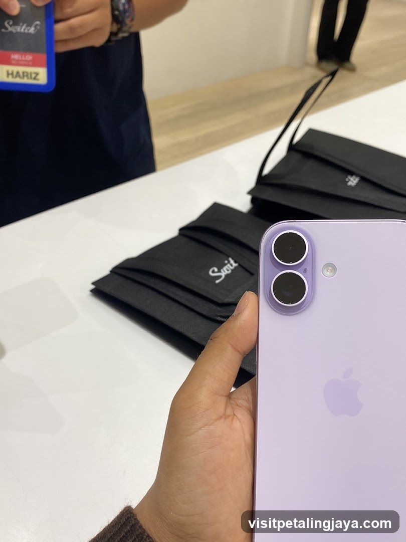 Person holding a purple iPhone