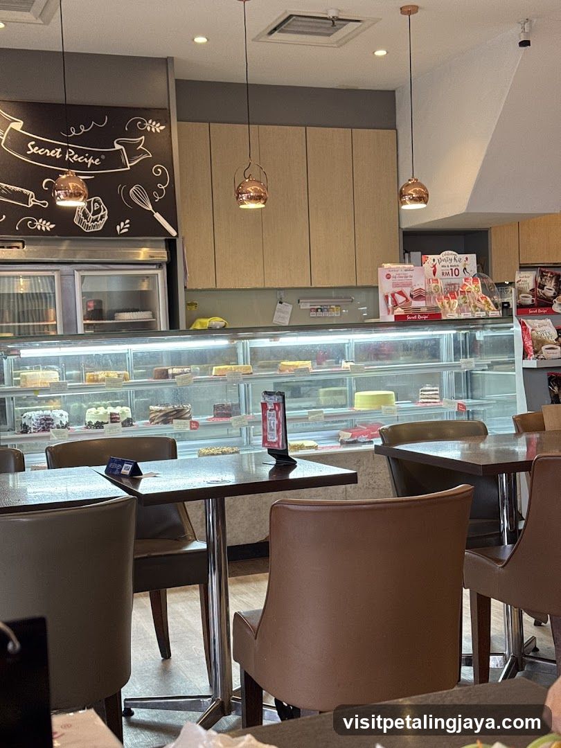 Interior of a cafe with display cases of cakes