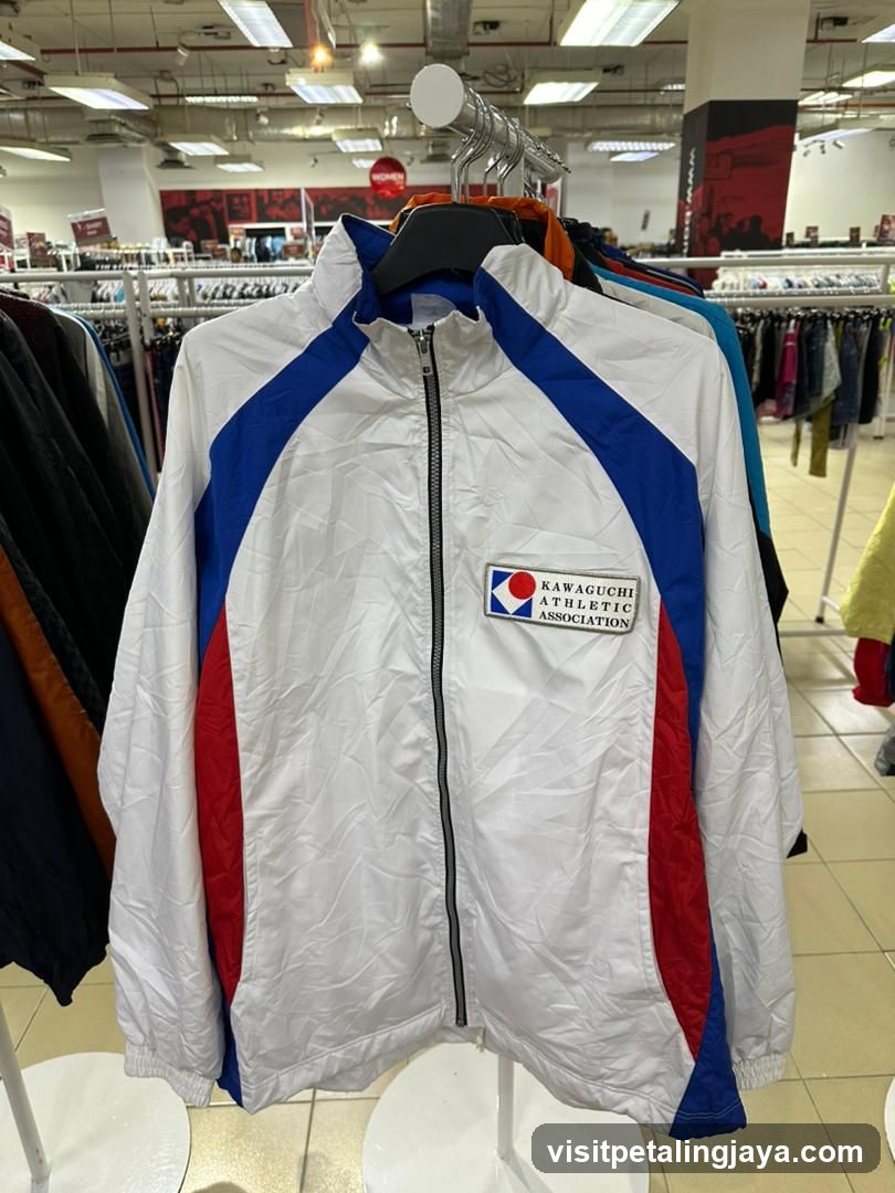 White athletic jacket with blue and red accents