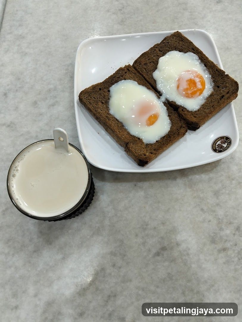 Soft-boiled eggs on toast with a drink