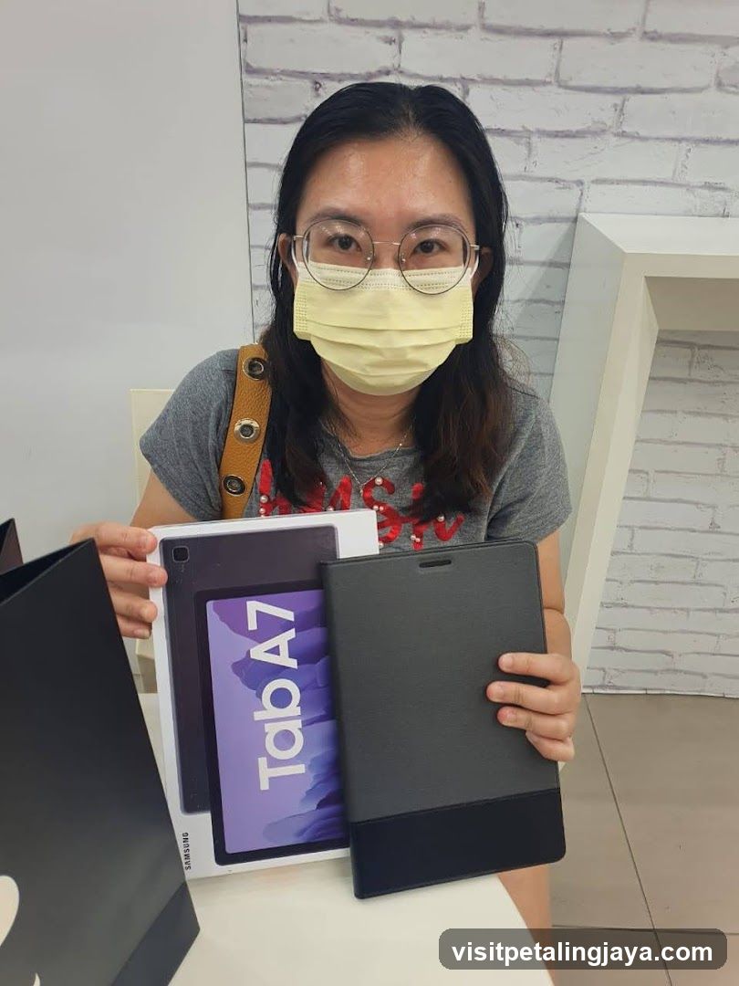 Woman holding a Samsung tablet and case