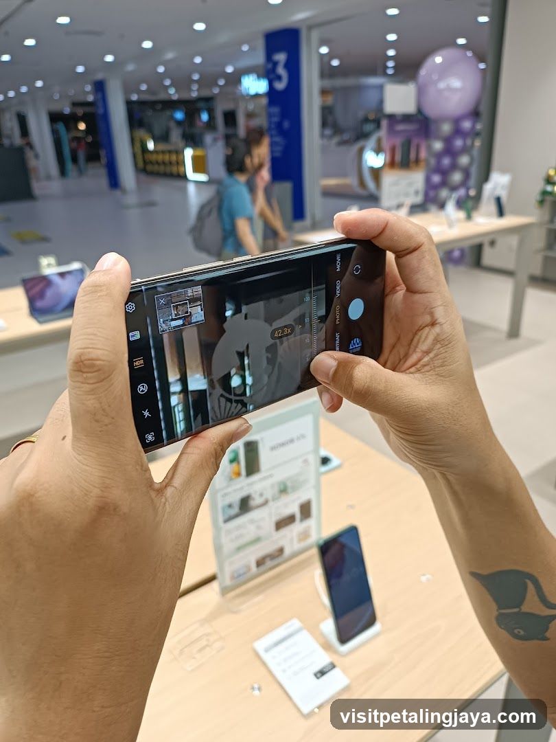 Person taking a photo of a display