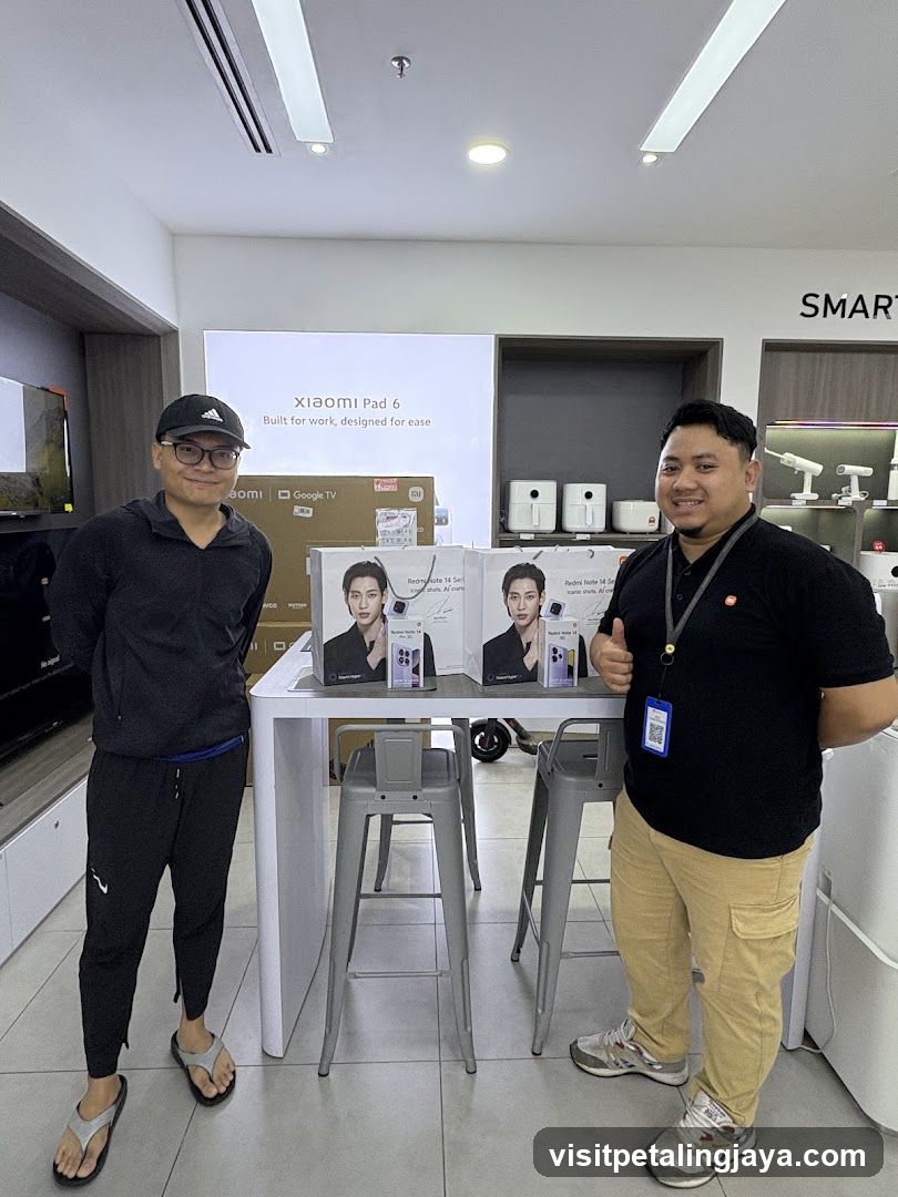 Two men in a store with Xiaomi products