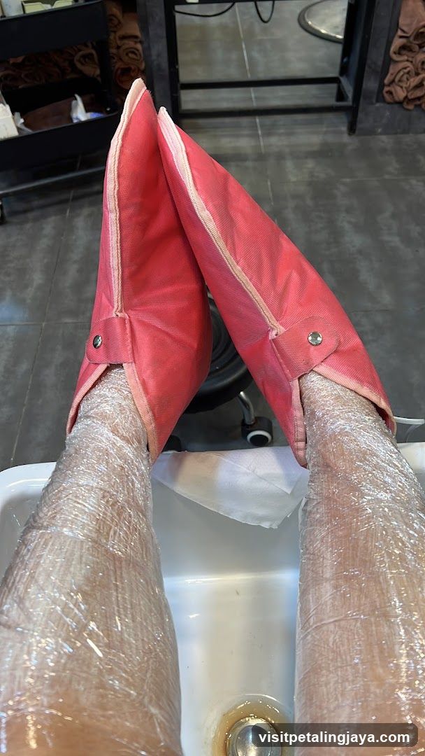 Legs wrapped in plastic with heating booties