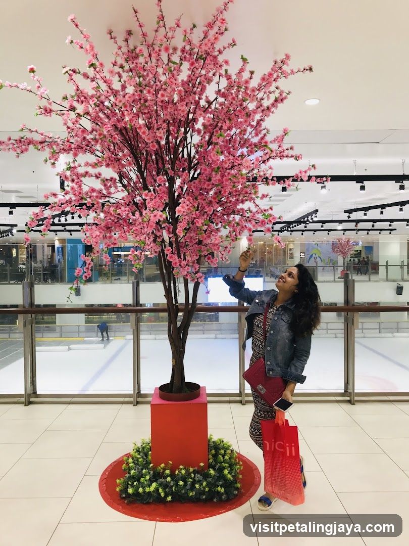 Woman admiring a cherry blossom tree