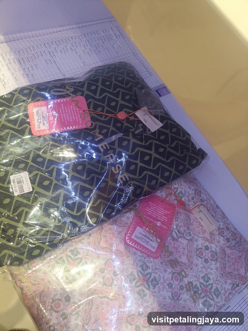 Two garments in plastic packaging