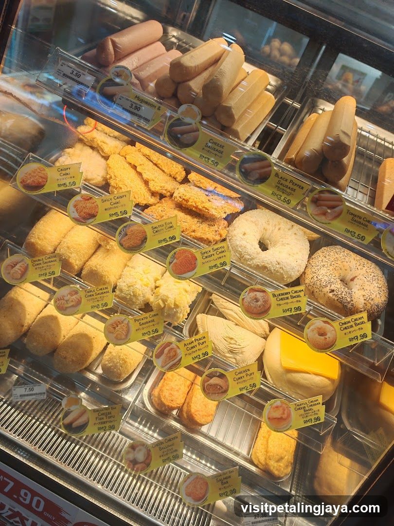 Assortment of fried snacks and sausages in a display case