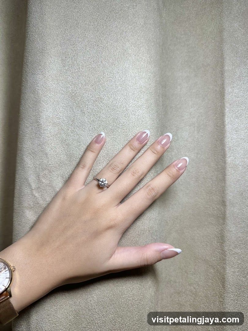 Hand with Ring and French Manicure