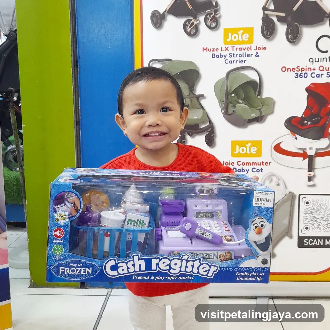 Child with Frozen Cash Register Toy