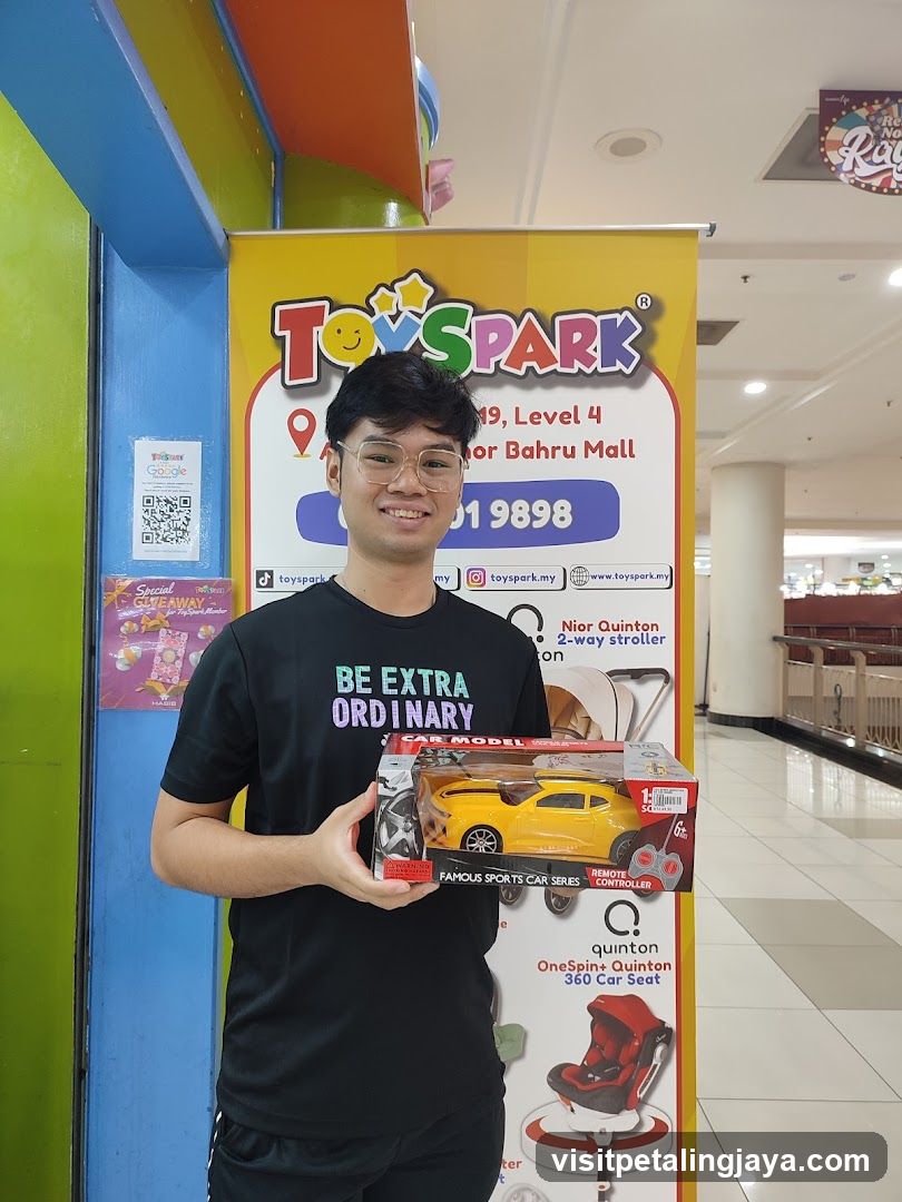 Man holding a toy car