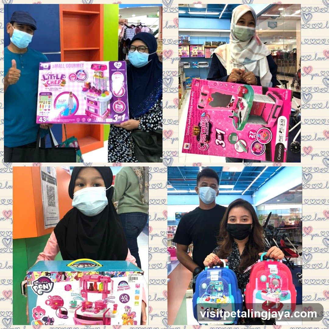 People holding toy kitchen sets
