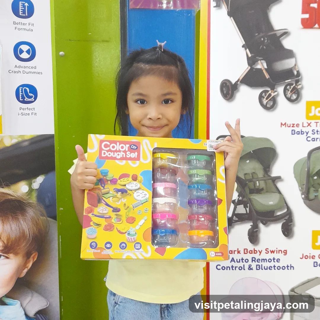 Girl Holding a Dough Set