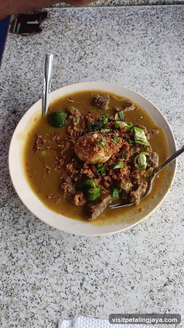 Bowl of Stew with Egg and Garnish