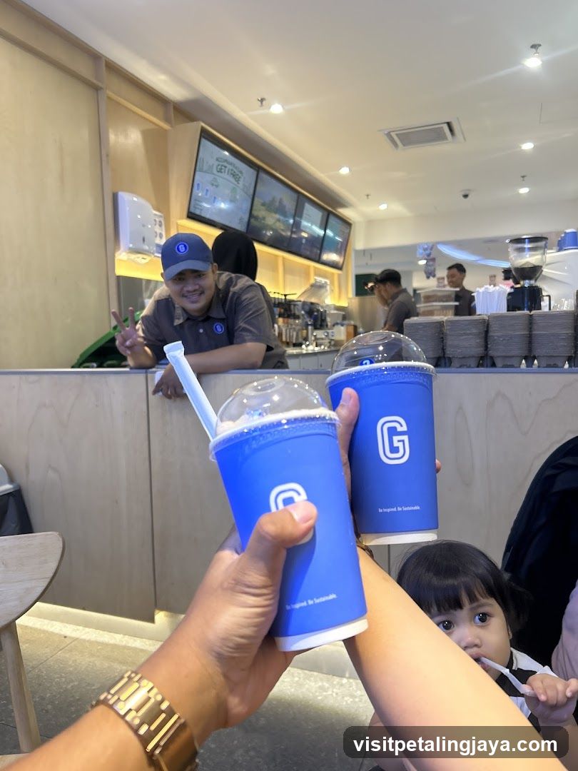 People holding drinks at a cafe