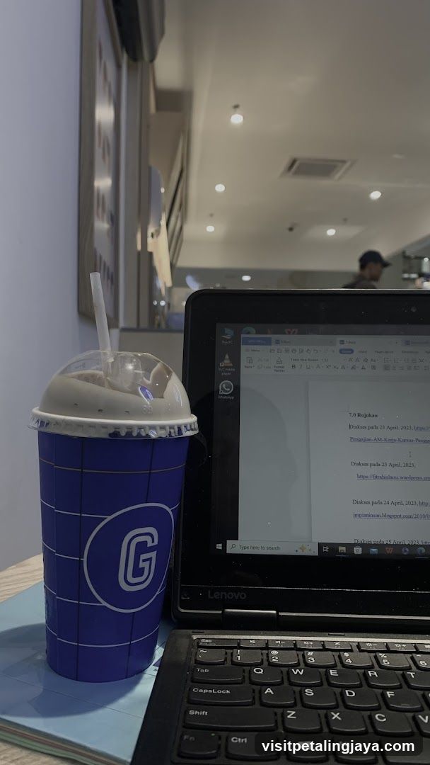 Beverage and Laptop