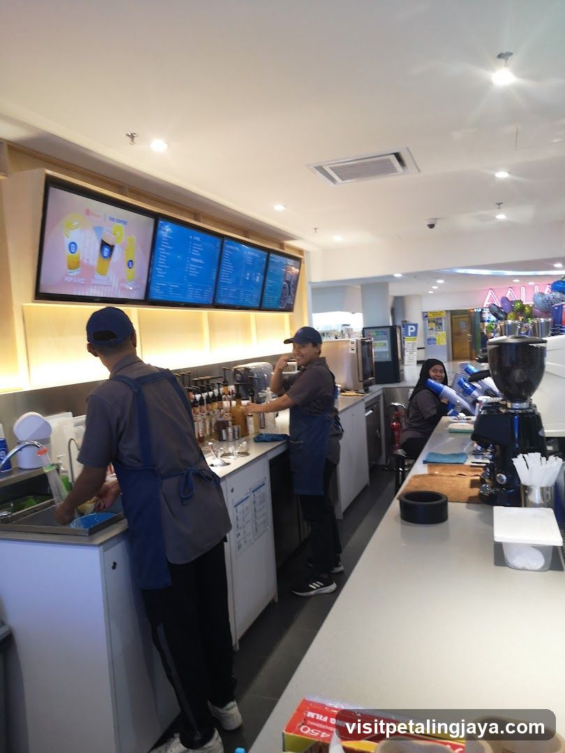 Baristas preparing drinks behind a counter