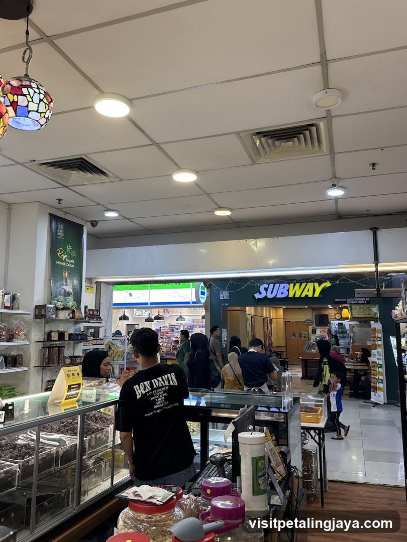 Interior of a shopping area with a Subway restaurant
