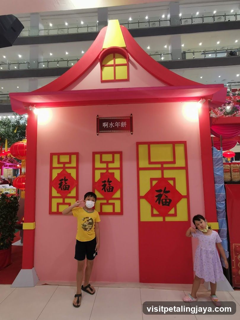 Children Posing in Front of a Festive Display