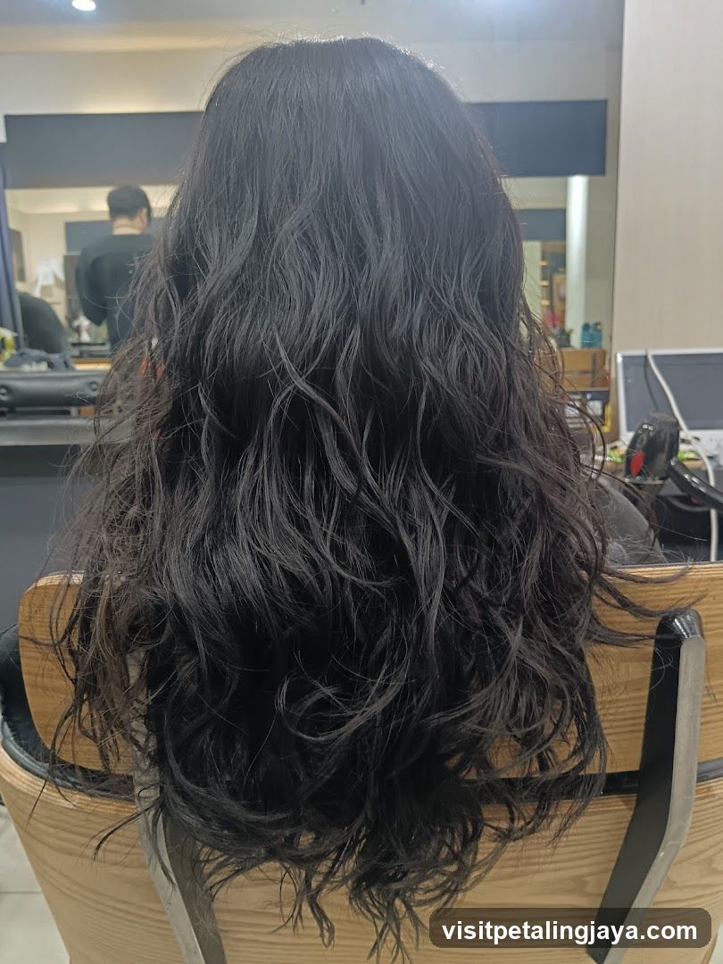 Woman's long, wavy dark hair