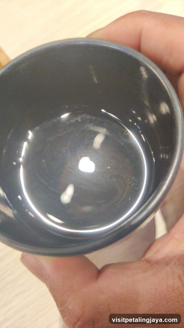 Hand holding a cup