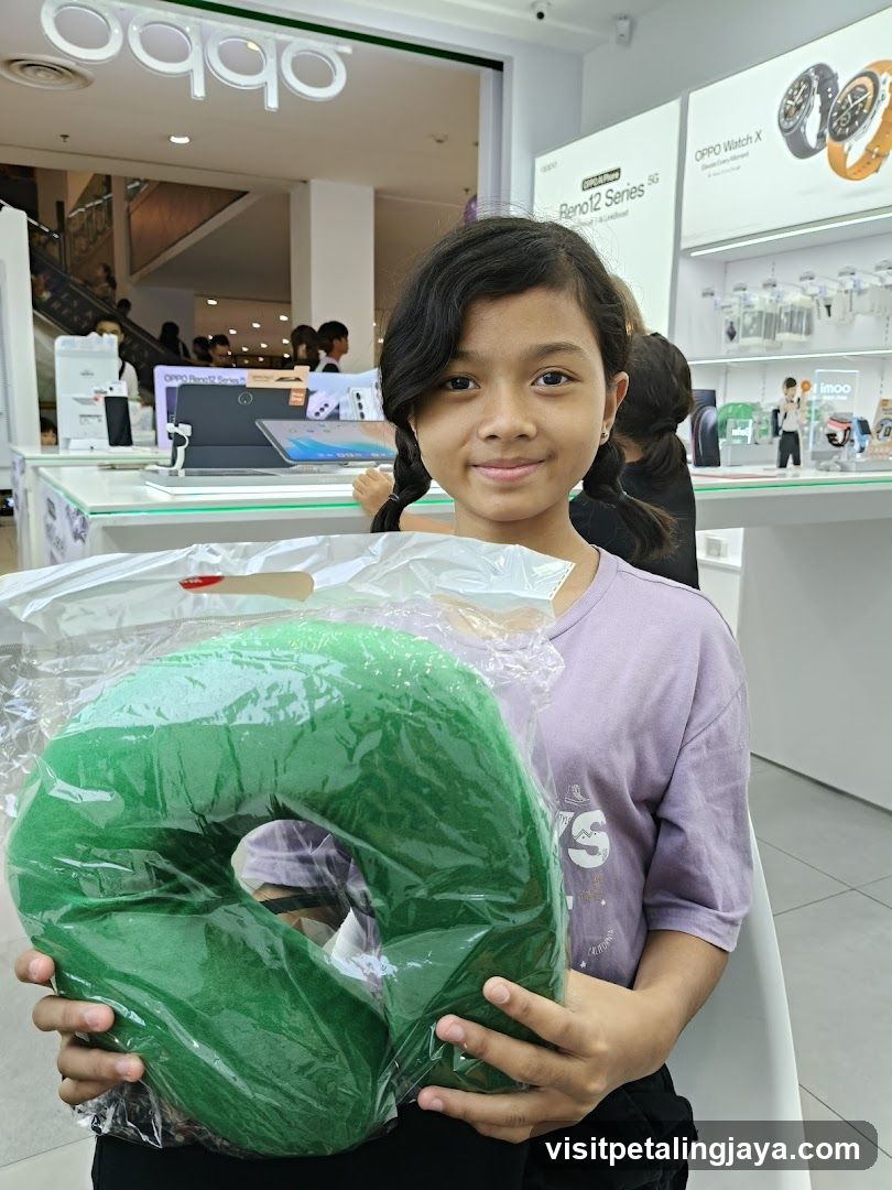 Child holding green item in OPPO store