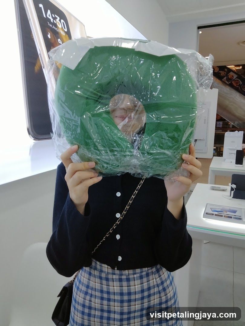 Person holding green product in store