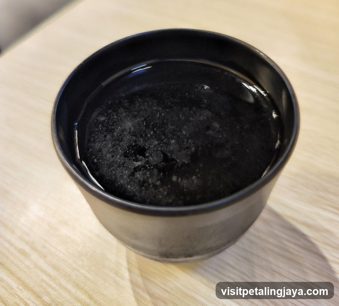 Black liquid in ceramic bowl
