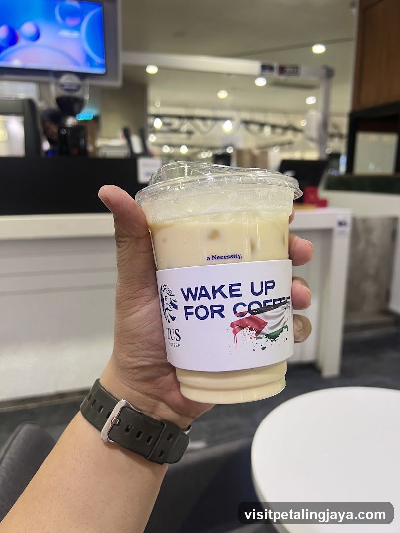 Hand holding coffee cup