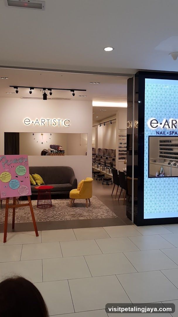 Nail Salon Interior with Seating and Promotions