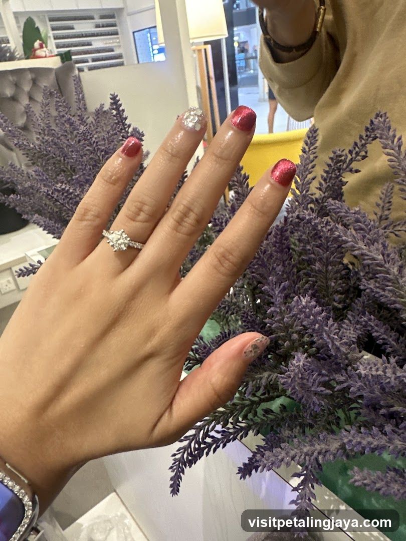Woman's hand with decorated nails and ring