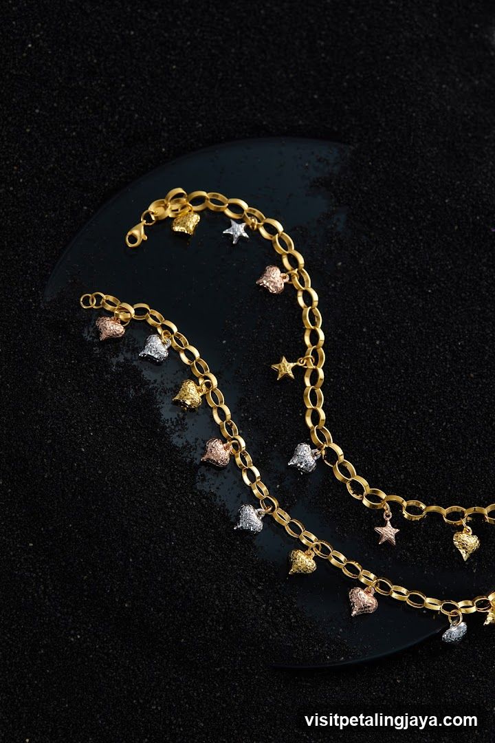 Gold bracelets with charms