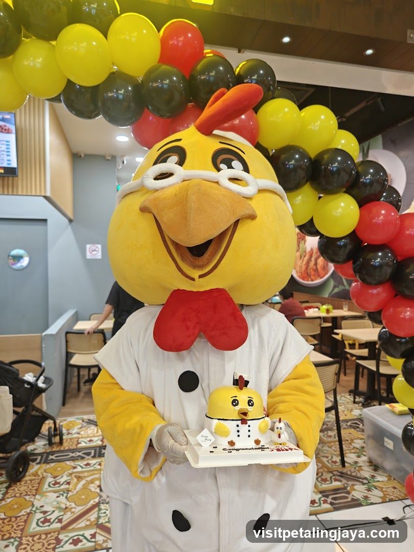 Mascot holding a cake