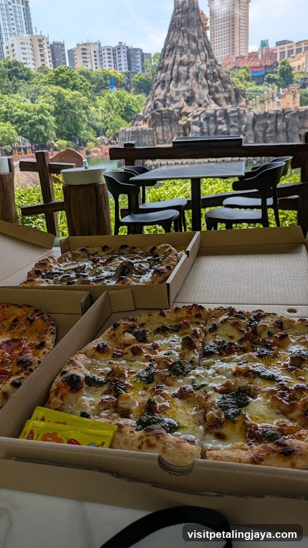 Pizzas on a table with a scenic background