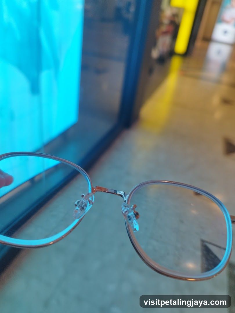 Eyeglasses in front of a display