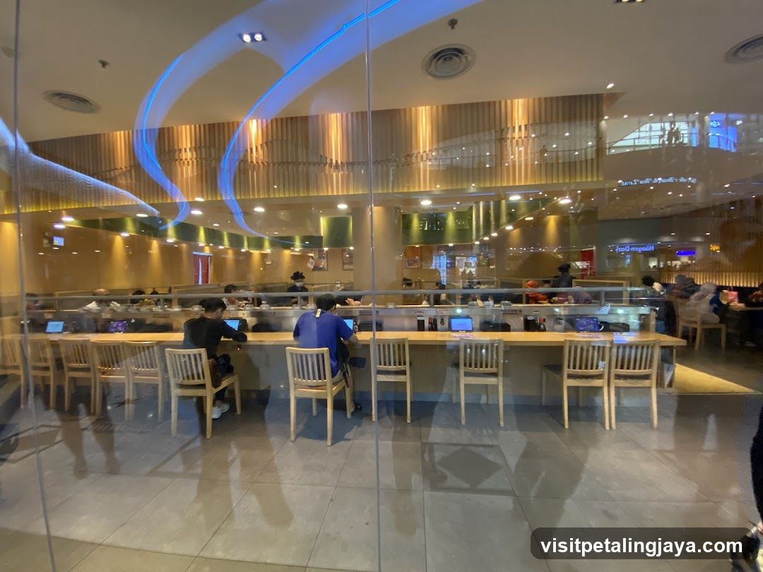 Interior of a restaurant with patrons seated at a counter