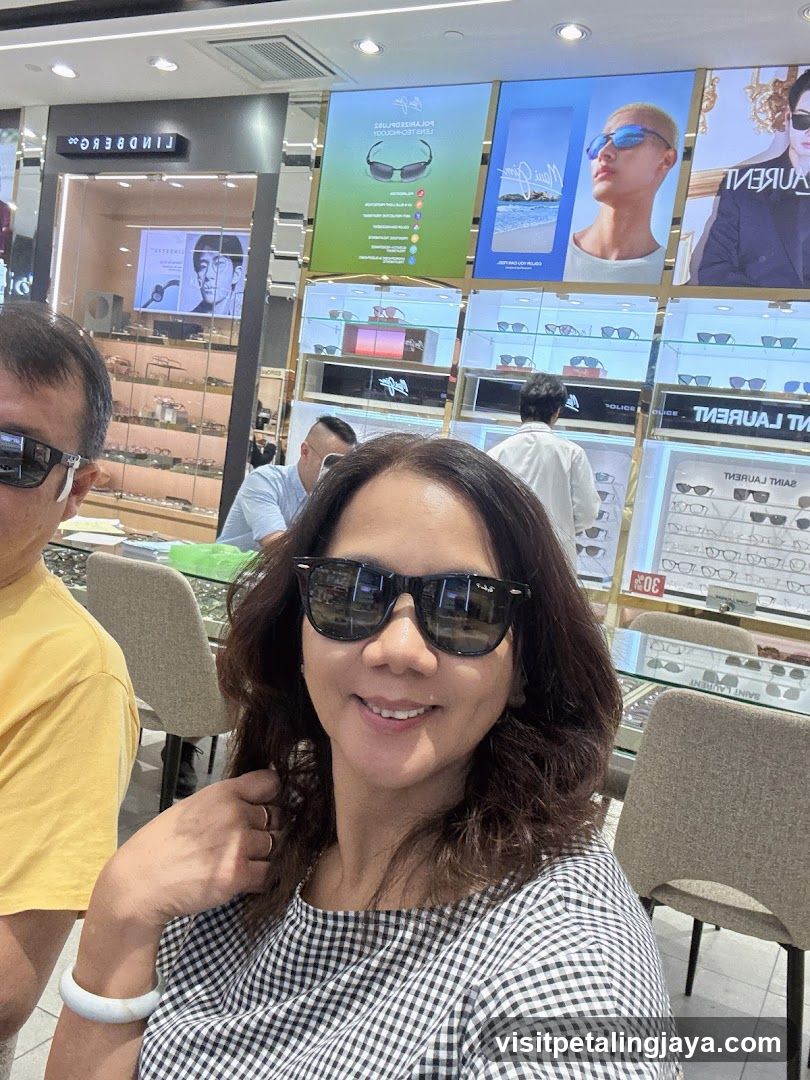 People trying on sunglasses in a store
