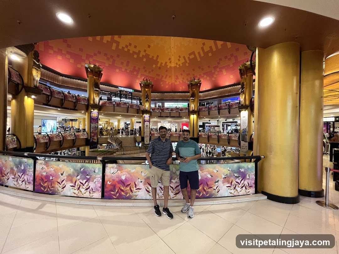 Two men posing in a shopping mall