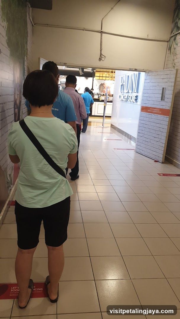 People in a queue at a store