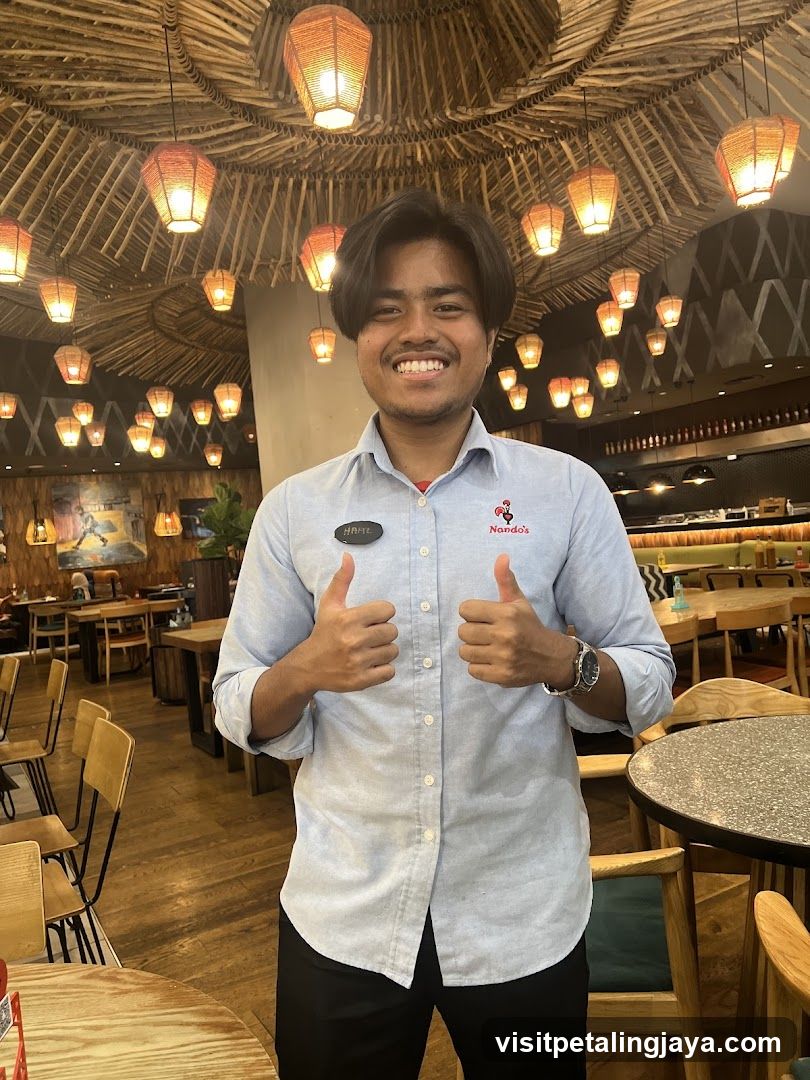 Staff member giving thumbs up