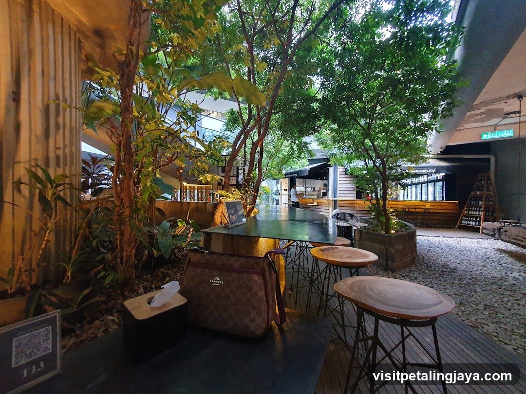 Outdoor seating area with lush greenery