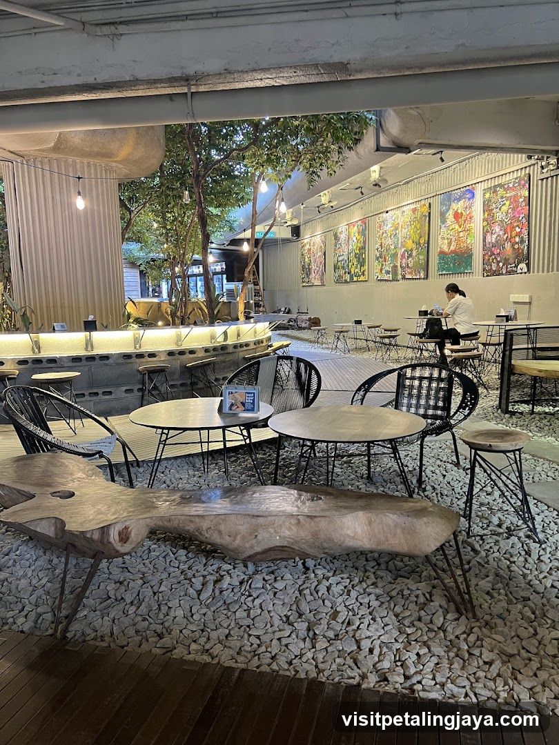 Outdoor cafe seating with artwork