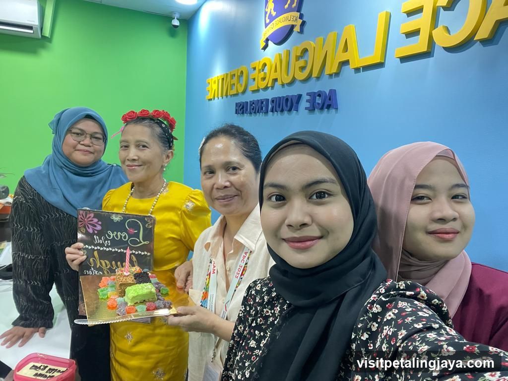 Group with Cake at ACE Language Centre