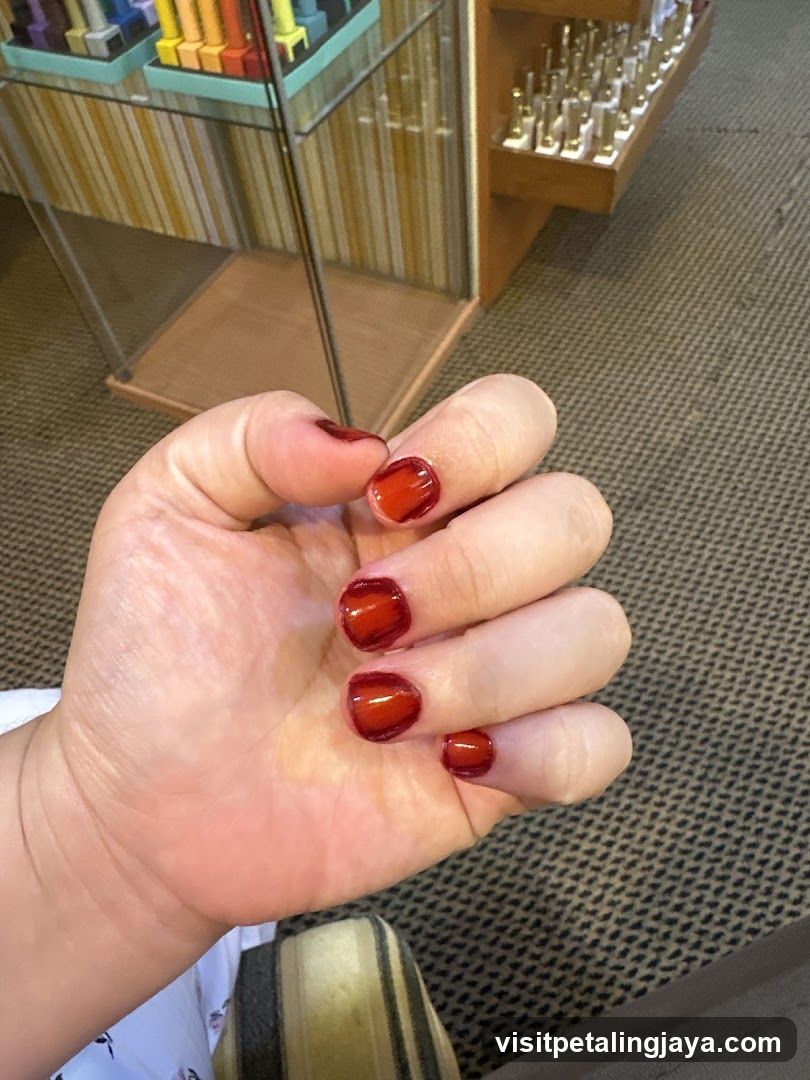 Hand with Red Nail Polish