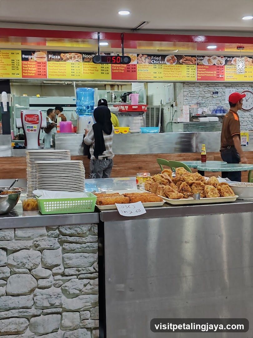 Food court counter with menu and fried food