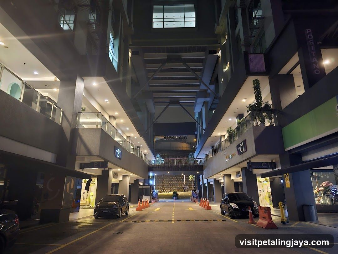 Night view of a multi-level shopping complex entrance
