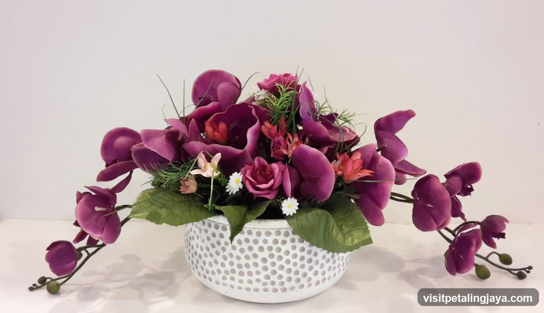 Artificial Flower Arrangement in White Perforated Pot