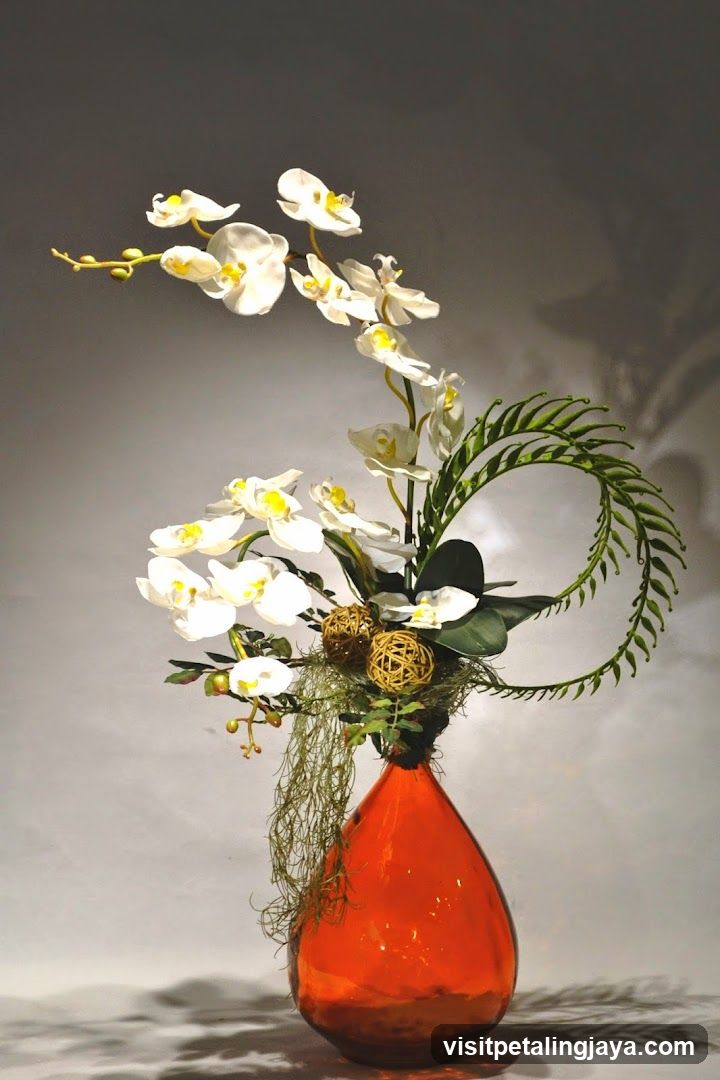 Orchid Arrangement in Orange Vase