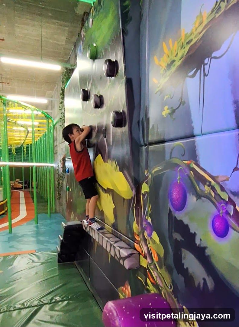 Child climbing a colorful wall