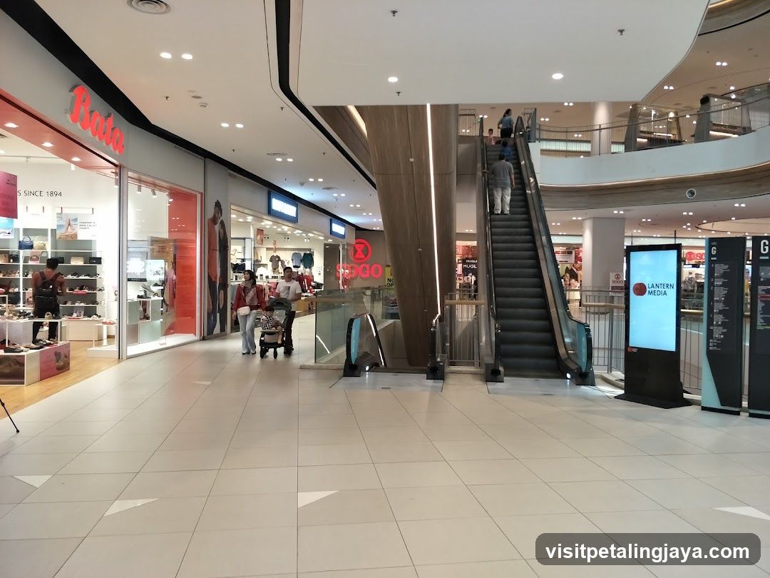 Shopping Mall Interior with Escalator and Storefronts
